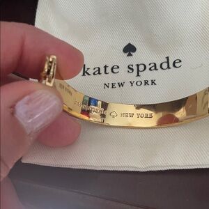 kate spade Gold-tone Logo Hinged Bangle Bracelet